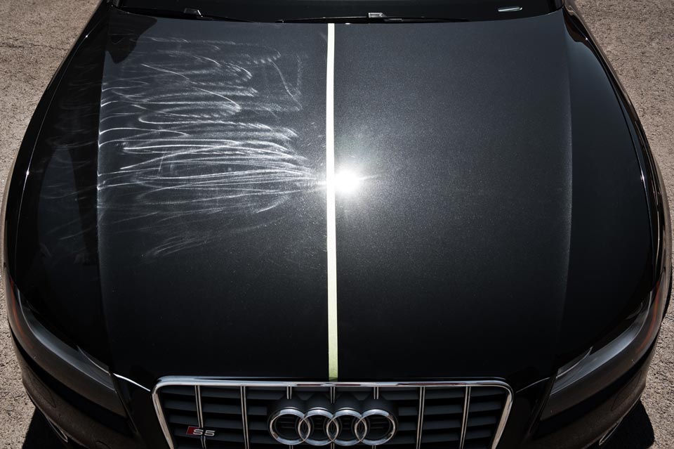 Paint protection film shielding car paint from rock chips and road debris