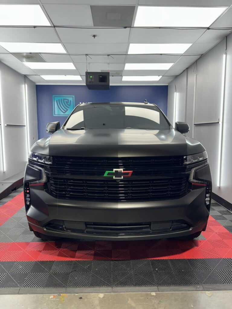 Chevy Tahoe satin black wrap by Wrap Royale Orlando FL luxury vehicle wrap shop professional car wrap installation