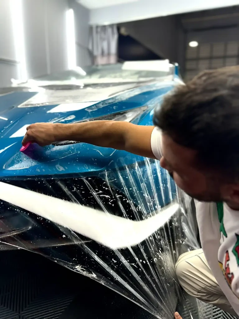 Premium Paint Protection Film (PPF) installation at Wrap Royale in Orlando, FL, protecting a luxury vehicle with an invisible shield against rock chips, scratches, road debris, and everyday wear.