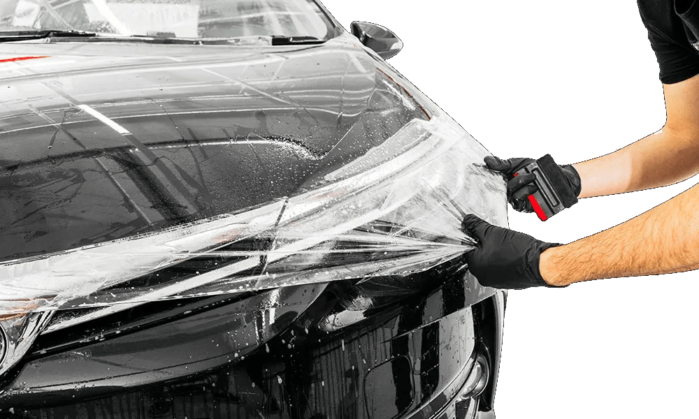 Paint Protection Film (PPF) installation on luxury vehicle in Orlando FL protecting paint from scratches and rock chips