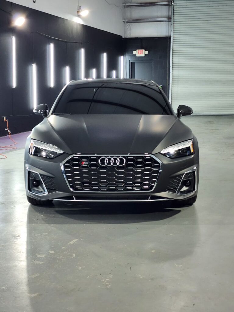 Black Audi with premium satin black vehicle wrap by Wrap Royale Orlando FL luxury car wrap shop