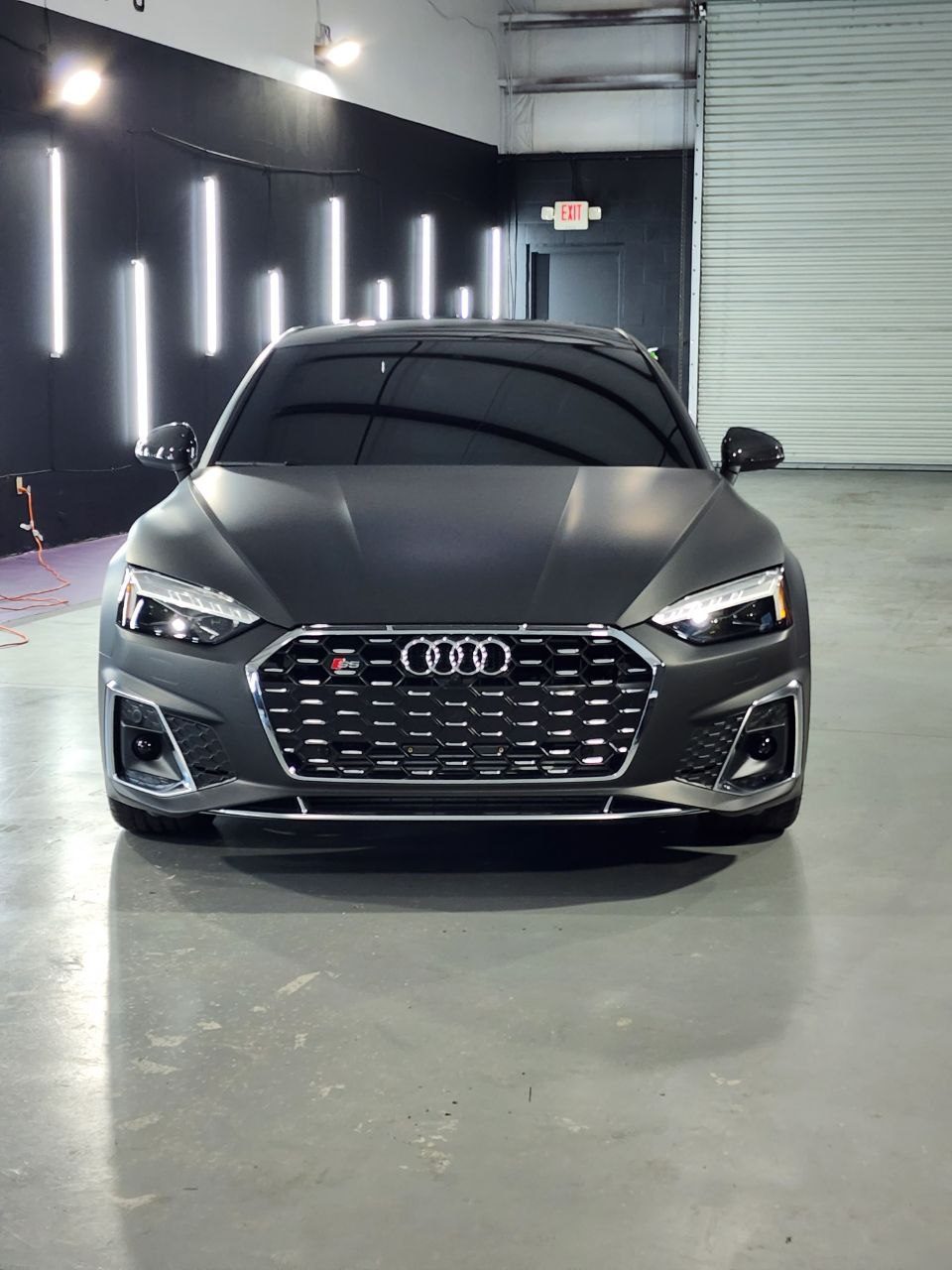 Black Audi with premium satin black vehicle wrap by Wrap Royale Orlando FL luxury car wrap shop