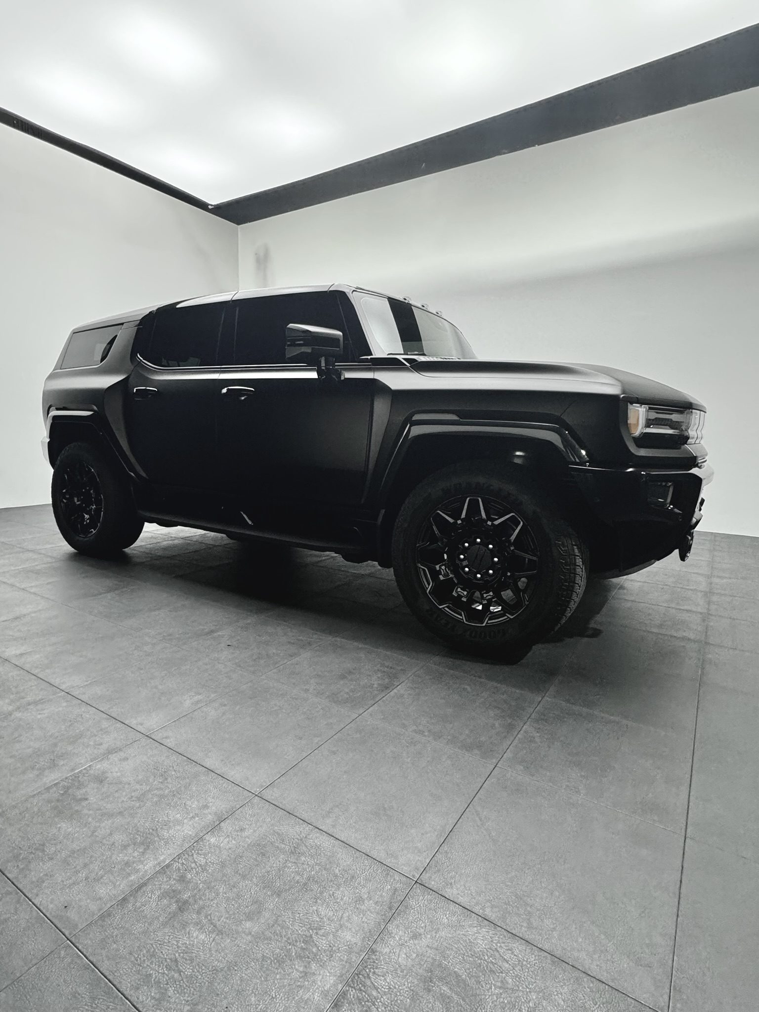 Hummer satin black wrap by Wrap Royale Orlando FL luxury vehicle wrap shop professional car wrap installation