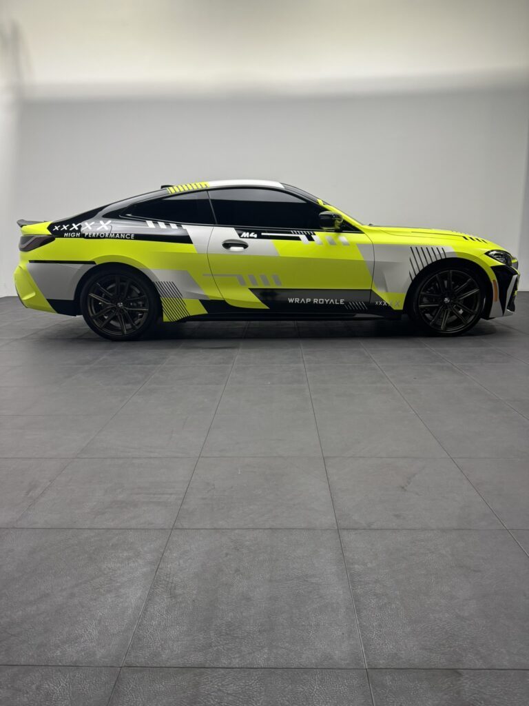 BMW M4 racing wrap with aggressive motorsport livery, showcasing premium car wrap installation by a luxury vehicle wrap shop in Orlando FL, featuring high-performance vehicle customization and exotic car protection design.